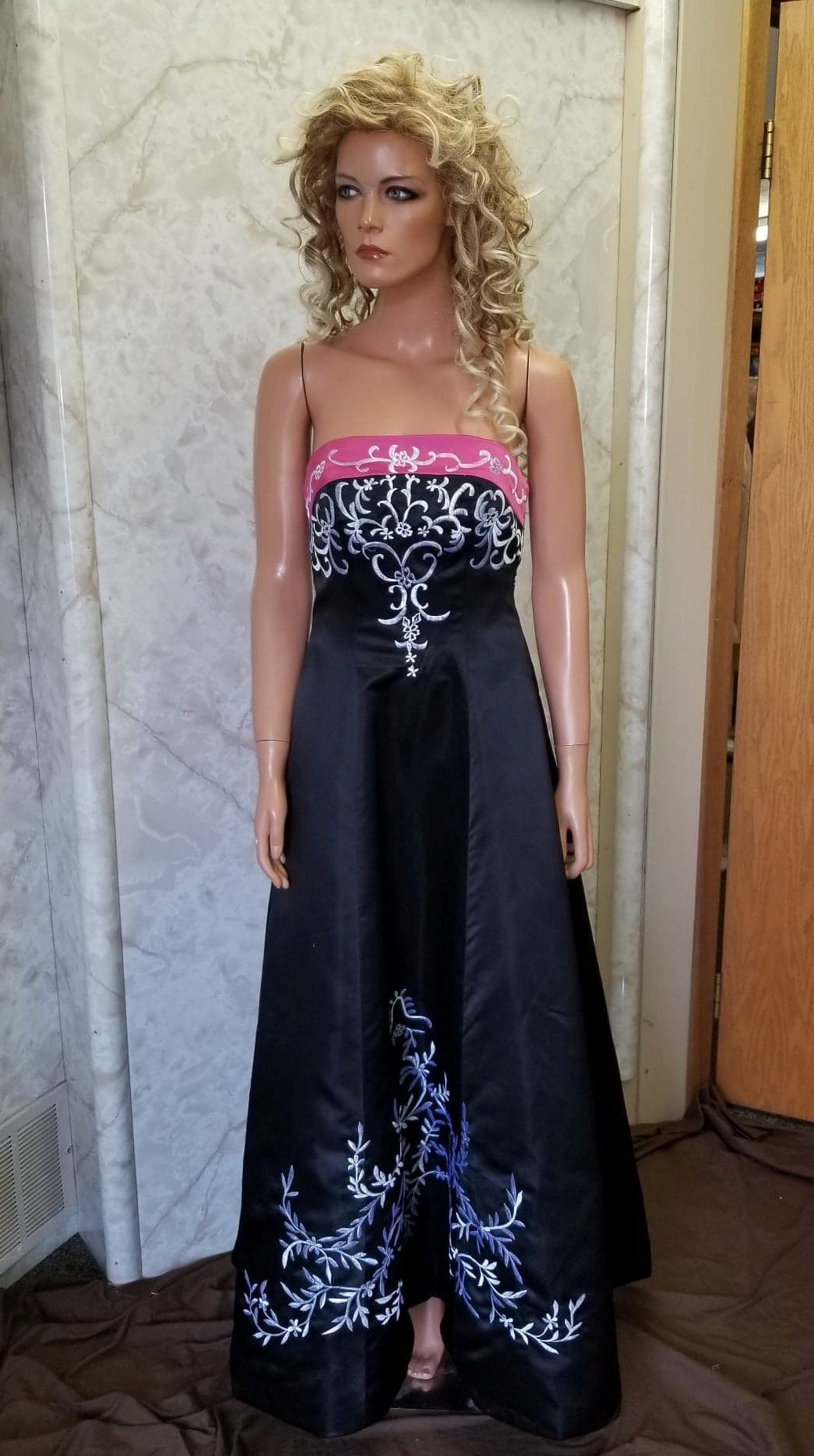 black dress with fuchsia trim and white embroidery